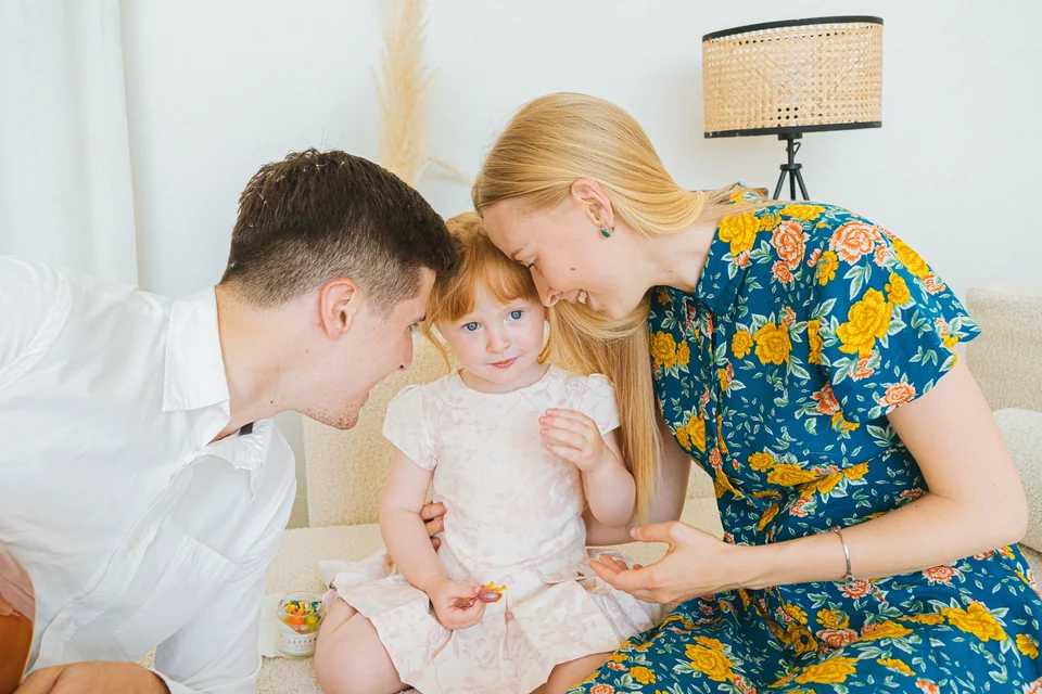 You want to share a photo with the parents visible and the child’s face hidden.